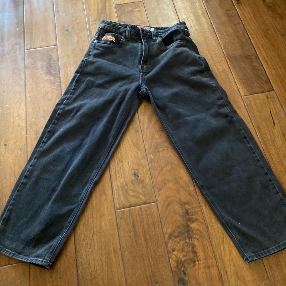 Cool black denim pants. Great for that baggy look and they are still very new.